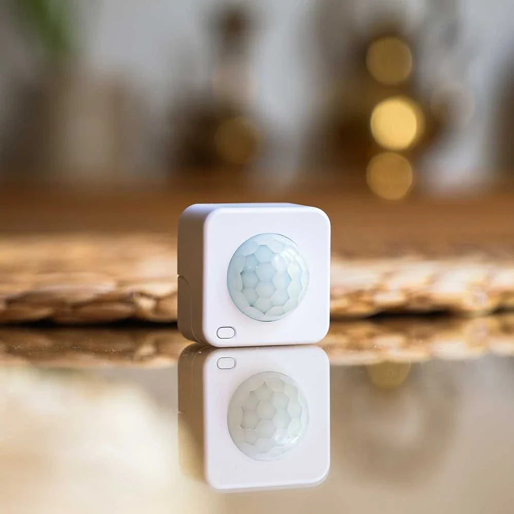 Small Square White Shelly device with Honeycomb circle infrared lense gold out of focus background mirror surface | Lykalyte