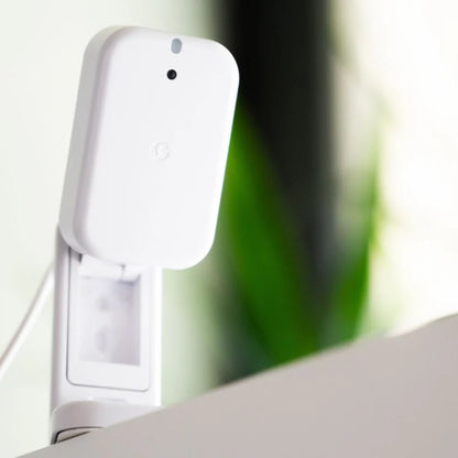 White Shelly Presence Gen4 attached to a surface with a blurred green and white background | Lykalyte