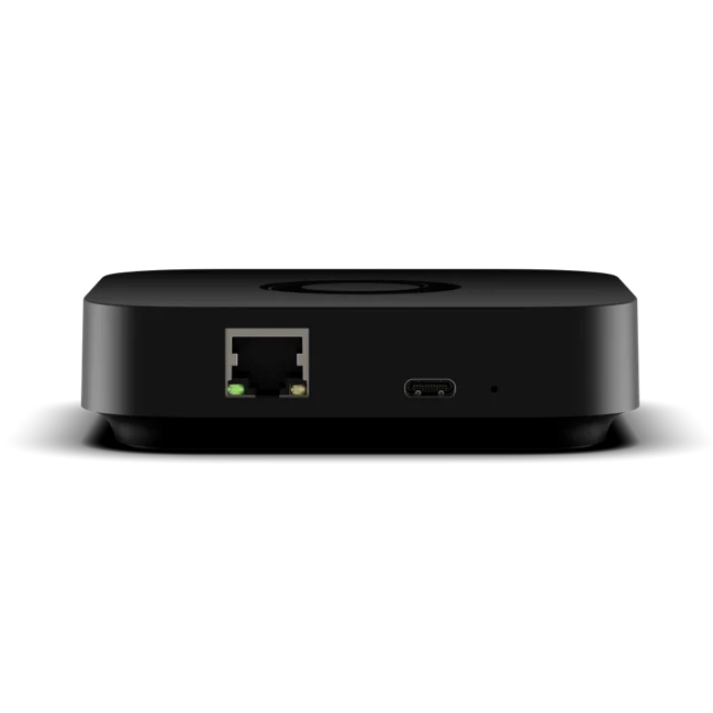 Homey Pro Mini back view with rounded corners, featuring a RJ45 Ethernet port with a green indicator light and a USB-C port on the front, shown against a plain white background. | Lykalyte