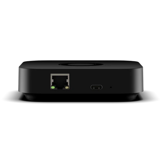 Homey Pro Mini back view with rounded corners, featuring a RJ45 Ethernet port with a green indicator light and a USB-C port on the front, shown against a plain white background. | Lykalyte
