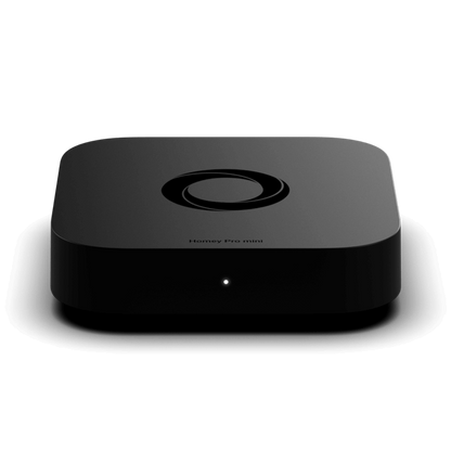 A Homey Pro mini smart home hub device in a glossy black finish, shown from a front-facing perspective on a white background with a soft reflection. | Lykalyte